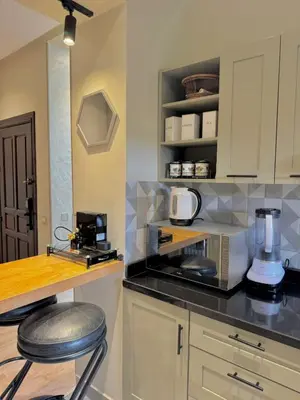 a kitchen with a counter top with a blender at Appartement à 2 min Gare agdal in Rabat