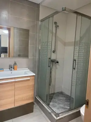 a bathroom with a shower and a sink at Luxury Stay Rabat Serenity in Rabat