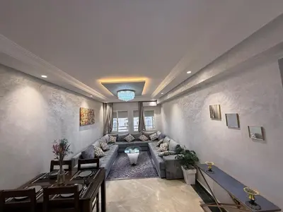 a large living room with a couch and a table at Aziz in Casablanca
