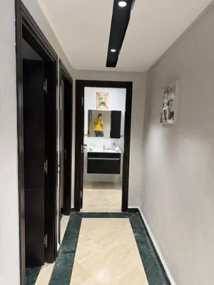 a hallway with a room with a desk and a mirror at Aziz in Casablanca