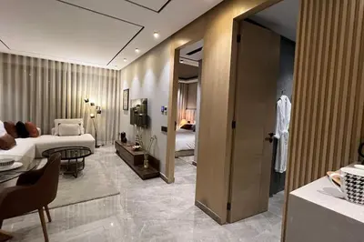 a hotel room with a bed and a living room at Casa The Address - By AppartAli in Casablanca