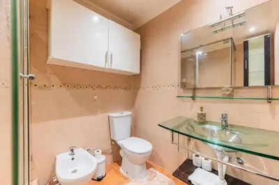 a bathroom with a toilet and a sink at Appartement Cosy et central in Casablanca