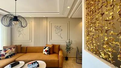 a living room with a couch and a flower wall at Casa Stop Spot - AppartAli in Casablanca