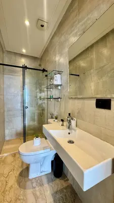 a bathroom with a sink and a toilet and a shower at Casa Stop Spot - AppartAli in Casablanca