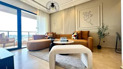 a living room with a couch and a table at Casa Stop Spot - AppartAli in Casablanca