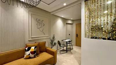 a lobby with a couch and a table in a room at Casa Stop Spot - AppartAli in Casablanca