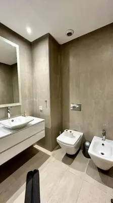 a bathroom with a sink and a toilet and a mirror at State of Peace in Marina - By AppartAli in Casablanca