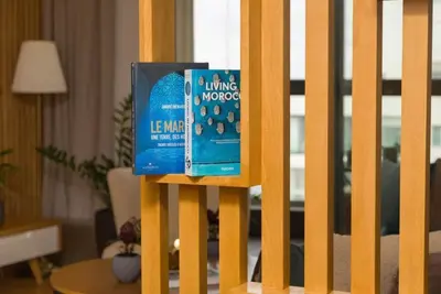 a book is sitting on top of a fence at La Terrazza at Marina - By AppartAli in Casablanca