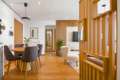 a kitchen and dining room with a table and chairs at La Terrazza at Marina - By AppartAli in Casablanca