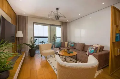 a living room with a couch and a table and chairs at La Terrazza at Marina - By AppartAli in Casablanca