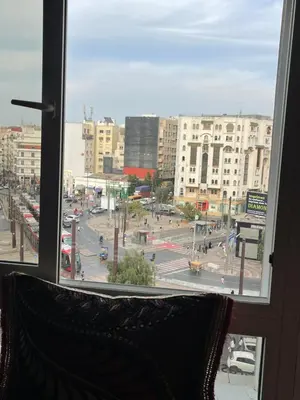 a view of a city street from a window at Furnished apartment in the middle of the city in Casablanca