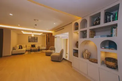 a living room with a couch and a bed in a room at Dally Apart Hotel in Rabat