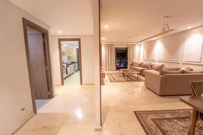 a living room with a couch and a table at Modern apartment with pool view Tamaris in Tamaris