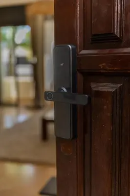 a black door handle on a wooden door at 3BR Apartment in Prestigious Hay Riad by MERAT HOME in Rabat