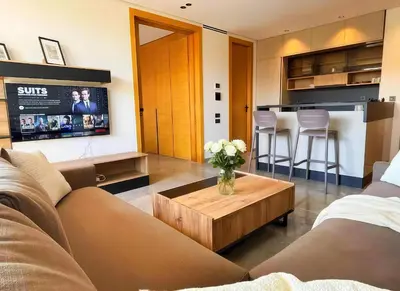 a living room with a couch and a table at Maya Suites - Opale Sea Side in Anfa-Supérieur