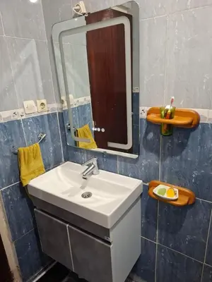 a bathroom with a sink and a mirror at Composed of 2 bedrooms and large living room in Casablanca