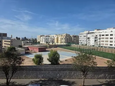 a view of a city with buildings and trees at Appartement vue sur le phare in Casablanca