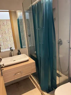 a bathroom with a shower and a sink at Appartement vue sur le phare in Casablanca