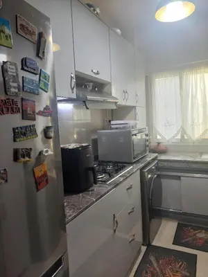 a kitchen with a stainless steel refrigerator and a stove at Kerouch house in Temara