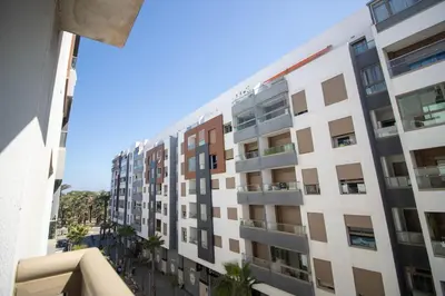a view of a building from a balcony at Appartement élégant a Parc Mohammedia - proche de la mer in Mohammedia