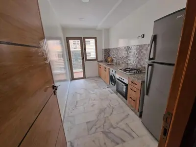 a kitchen with a refrigerator and a stove at فيكتوريا in Casablanca