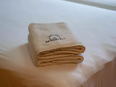 a pile of towels sitting on top of a table at The Pearl - 3 Chambres Marina - By AppartAli in Casablanca