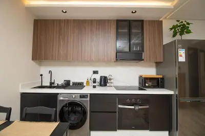 a kitchen with a washer and a dishwasher at 2 Bedroom Apartment City Center in Casablanca