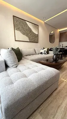 a living room with a couch and a table at 2 Bedroom Apartment City Center in Casablanca