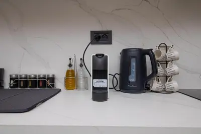 a counter top with a coffee maker and a blender at 2 Bedroom Apartment City Center in Casablanca