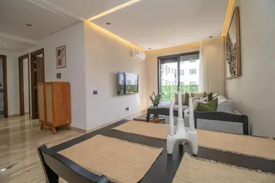 a living room with a couch and a table at 2 Bedroom Apartment City Center in Casablanca