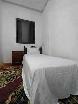 a bedroom with a white bed and a mirror at New Luxury Apart Victoria- Casablanca 2BR