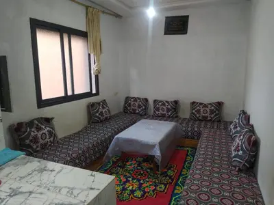 a living room with a couch and a table at New Luxury Apart Victoria- Casablanca 2BR