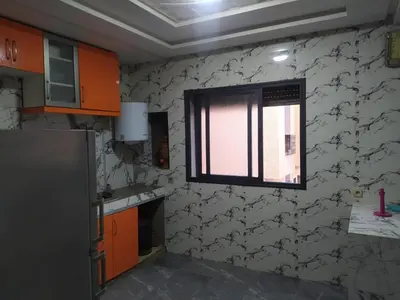 a kitchen with a window in the wall at New Luxury Apart Victoria- Casablanca 2BR