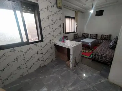 a room with a couch and a table in a room at New Luxury Apart Victoria- Casablanca 2BR
