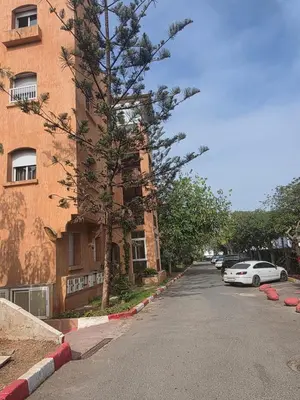a car parked on a street next to a building at Dar Tourabi in Casablanca