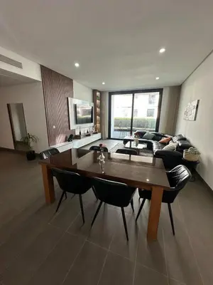 a living room with a table and a couch at Nams Casa Home in Casablanca