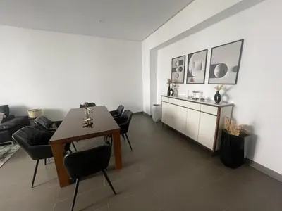a living room with a table and chairs and a couch at Nams Casa Home in Casablanca