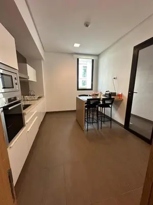 a kitchen with a table and chairs in a room at Nams Casa Home in Casablanca