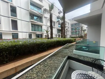 an external view of a building with a glass walkway at Nams Casa Home in Casablanca