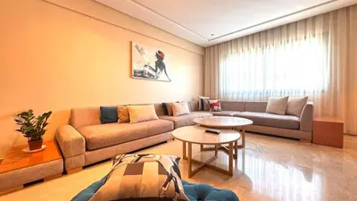 a living room with a couch and a table at Family Trips or Professional Travels -By AppartAli in Casablanca