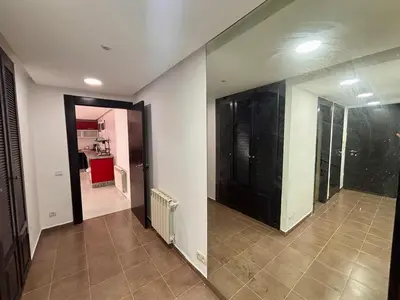 a room with a hallway with a door and a kitchen at Villa Miraluna ,Jacuzzi Retreat in Tamaris