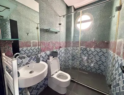 a bathroom with a toilet and a sink at Villa Miraluna ,Jacuzzi Retreat in Tamaris