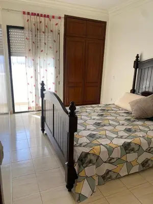 a bedroom with a large bed in a room at Saad home in Casablanca
