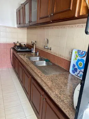 a kitchen with a sink and a counter top at Saad home in Casablanca