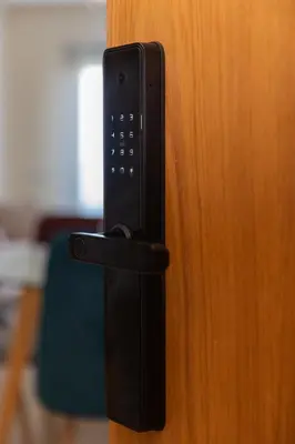 a black door handle on a wooden door at Homerest appartement Casablanca in Casablanca