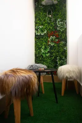 a table and two chairs in a room with a painting at Terrace Solarium & Fitness & Berber Tradition in Casablanca