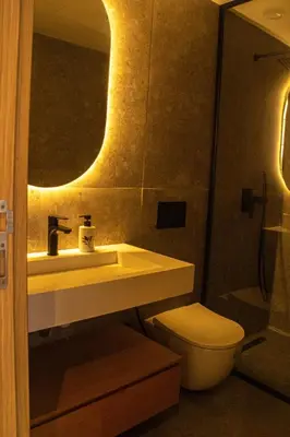 a bathroom with a sink and a toilet and a mirror at Terrace Solarium & Fitness & Berber Tradition in Casablanca