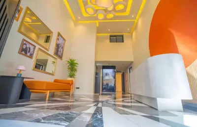 a lobby of a building with a yellow ceiling at Terrace Solarium & Fitness & Berber Tradition in Casablanca