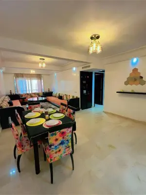 a living room with a table and chairs and a couch at Paradise Casablanca in Casablanca