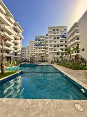 a swimming pool in front of some apartment buildings at Charming Apartment Residence Ocean Park Pool, Sea in Aïn Harrouda
